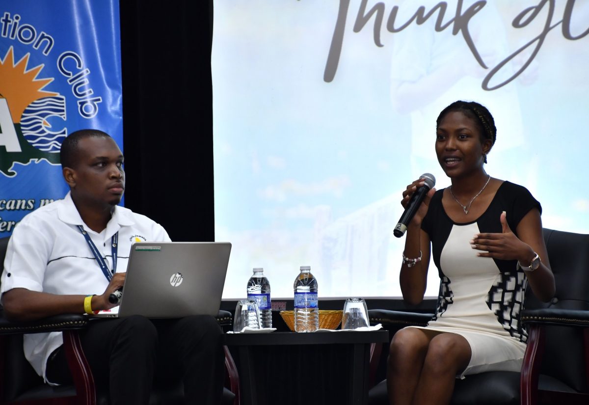 Tourism enthusiast, Katrina Chin (right), a student at the University of the West Indies (UWI), makes a point during a panel discussion at the Tourism Awareness Week Youth Forum, held at the Montego Bay Convention Centre in St. James on September 27. Listening is University of Technology student, Kawaine Anderson.