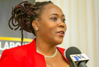 Divisional Director, Industrial Relations and Allied Services, Ministry of Labour and Social Security, Gillian Corrodus.

