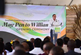 Minister of Science, Energy, Telecommunications and Transport, Hon. Daryl Vaz, addresses the opening ceremony for the Southern Coastal Highway Improvement Project Part A (May Pen to Williamsfield) on September 14.