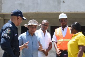 Deputy Prime Minister and Minister of National Security, Hon. Dr. Horace Chang (second left), holds discussions with (from left), Police Commissioner, Major General Antony Anderson; Member of Parliament, Westmoreland Western, Morland Wilson; Manager,Marlon Turner Construction, Marlon Turner; and Senior Project Manager in the National Housing Trust’s (NHT) Special Projects Unit , Jacqueline Johnson. The occasion was a recent tour of the Frome and Little London Police stations’ construction sites in Westmoreland.

