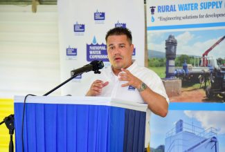 Minister without Portfolio in the Ministry of Economic Growth and Job Creation, Senator the Hon. Matthew Samuda, addresses the commissioning ceremony for the $95-million Connors/Ginger Ridge Water Scheme in St. Catherine West Central, at the Ginger Ridge Primary School in St. Catherine, on October 11.

