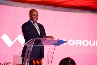 Minister of Industry, Investment and Commerce, Senator the Hon. Aubyn Hill, brings remarks at the launch of the VM Financial Group Business Finance Suite in association with the Development Bank of Jamaica (DBJ) and the Jamaica Manufacturers and Exporters Association (JMEA). The event was held at the Terra Nova All-Suite Hotel in St. Andrew on Tuesday (October 24).