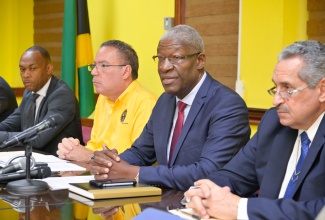 Transport Authority Chairman, Owen Ellington (second right), addresses a recent press conference at the Ministry of Science, Energy, Telecommunications and Transport. Also participating (from left) are Managing Director, Transport Authority, Ralston Smith; Minister of Science, Energy, Telecommunications and Transport, Hon. Daryl Vaz; and Managing Director, Jamaica Urban Transit Company (JUTC), Paul Abrahams.

