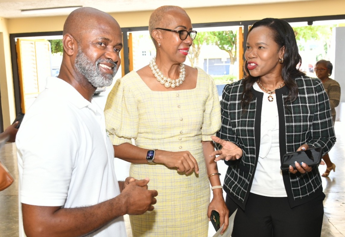 Minister of Education and Youth, Hon. Fayval Williams (centre), and Permanent Secretary in the Ministry, Dr. Kasan Troupe, engage with head of diaspora non-profit organisation, Team Jamaica Bickle (TJB), Irwine Clare, at the handover of automated external defibrillators (AED) on October 18 at the University of Technology (UTech) in St. Andrew. The devices, donated by TJB, are used to help persons experiencing sudden cardiac arrest. They will be distributed to local secondary level institutions, and training will be facilitated in the use of the devices. TJB has been an advocate for athlete development from high school through to college and beyond, for almost 30 years. The initiative to provide defibrillators to schools is aimed at improving the safety and health of young athletes in Jamaica.