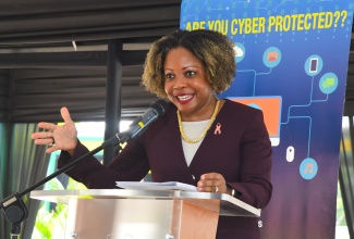 Minister without Portfolio in the Office of the Prime Minister with oversight for Skills and Digital Transformation, Senator Dr. the Hon. Dana Morris Dixon, delivers the keynote address during National Cybersecurity Awareness Day 2023, held at the Petroleum Corporation of Jamaica in Kingston on Thursday (October 26).

