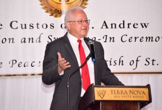 Minister of Justice, Hon. Delroy Chuck, addresses the commissioning ceremony for more than 100 new Justices of the Peace (JPs) on October 1, for the parish of St. Andrew, at a ceremony held at the Terra Nova All-Suite Hotel in the parish.