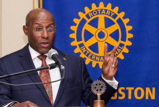 Minister of Industry, Investment and Commerce, Senator the Hon. Aubyn Hill, delivers the keynote address at a general breakfast meeting of the Rotary Club of New Kingston at the Liguanea Club, today (October 27).