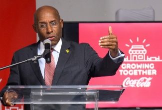 Minister of Industry, Investment and Commerce, Senator the Hon. Aubyn Hill, addresses the audience at Wisynco’s ‘Growing Together’ Training Programme, held at Wisynco’s Headquarters in Lakespen, St. Catherine, on October 5. The training is a free digital programme for Wisynco shopkeepers and small businesses. The programme will give individuals the tools to navigate the business environment and help their business grow.

 