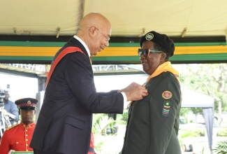 Beulett Carol Hunter receives the Badge of Honour for Meritorious Service for her commitment to advancing Uniformed Youth Groups in Schools and Communities from Governor-General, His Excellency the Most Hon. Sir Patrick Allen, at this year’s National Honours and Awards Ceremony, held at King’s House on October 16.
