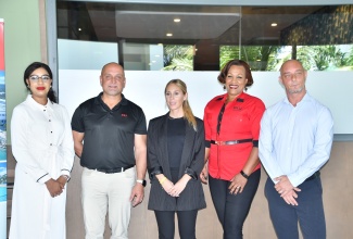 RIU Executives (from left) Construction and Administration Manager, Francene Wright-Acosta; Regional Director, Jamaica, Frank Sondern; Communications Manager, Jamaica, Aruba, United States and Canada, Sara Fernandez De Alacron; Director of Sales, Niurka Garcia-Linton; and Entertainment Director, Jamaica, Michael Blank, share a photo opportunity following a press conference at RIU Montego Bay, St James, on Friday (October 20).

