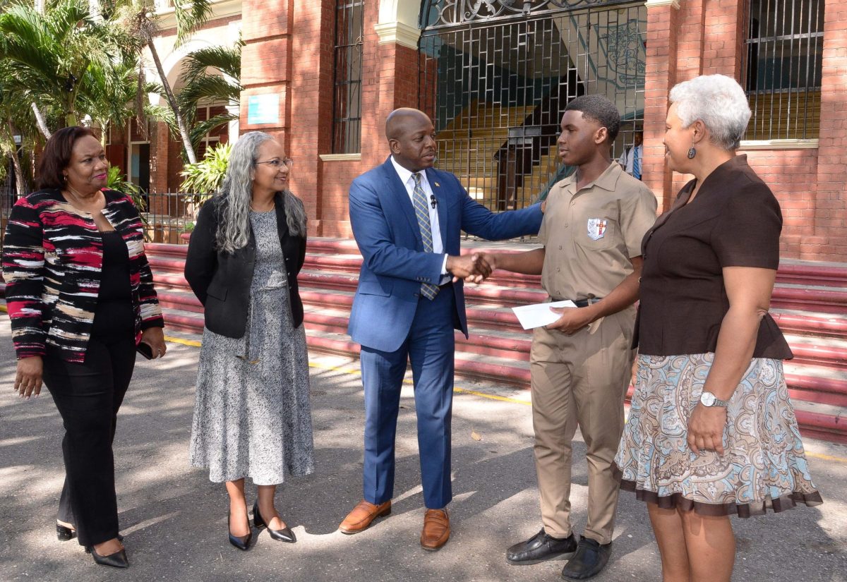 PHOTOS: Minister Charles Jr. Presents Cheque to St. George’s College Student