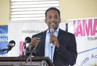 Executive Director of the Tourism Enhancement Fund (TEF), Dr. Carey Wallace, gives remarks during a devotional exercise at the Mannings School in Savanna-la-Mar, Westmoreland on Friday (September 29).