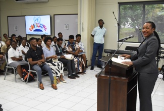 Minister of State in the Ministry of Education and Youth, Hon. Marsha Smith (at podium), addresses the United Nations (UN) Club Colloquium held on Tuesday (October 24) at Hillel Academy in St. Andrew to mark UN Day. This year’s observance marked the 78th anniversary of the entry into force of the UN Charter on October 24, 1945. The Charter sets out the rights and obligations of Member States and establishes the principal organs and procedures of the UN.

