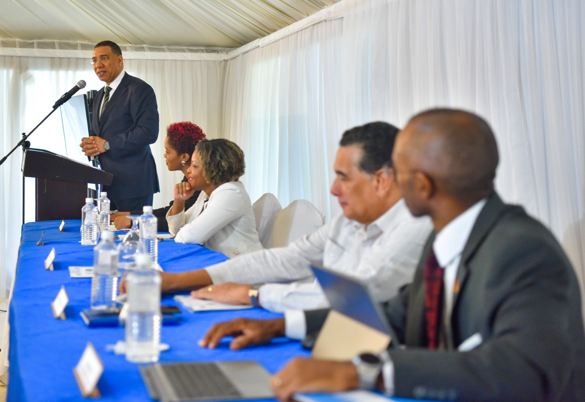 Prime Minister, the Most Hon. Andrew Holness, delivers the keynote address during the Office of the Prime Minister’s (OPM) strategic planning retreat, held recently at the Terra Nova All Suite Hotel in St. Andrew. Listening (from left) are: Chief Technical Director, OPM, Shereika Hemmings Allison; Minister without Portfolio with Responsibility for Skills and Digital Transformation, Senator Dr. the Hon. Dana Morris Dixon; Minister of State, Hon. Homer Davis; and Permanent Secretary, Ambassador Dr. Rocky Meade.

