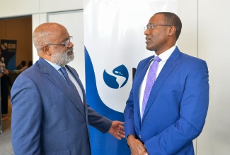 Minister of Finance and the Public Service, Dr. the Hon. Nigel Clarke (right), converses with General Manager, Country Department Caribbean Group and Country Representative, Jamaica, Inter-American Development Bank (IDB), Anton Edmunds, during the opening session for the IDB’s Sub-Regional Policy Dialogue on Ecosystems of Entrepreneurship and Innovation in the Caribbean Region, at the AC Hotel by Marriott Kingston on Wednesday (October 18).

