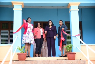 Minister of State in the Ministry of Education and Youth, Hon. Marsha Smith (right), along with (from left) Executive Director, Transformation Implementation Unit (TIU), Maria Thompson Walters; Manager at the Muirton Boys’ Home, Shanae Walsh Webber and Chief Executive Officer, CPFSA, Laurette Adams-Thomas, share in the ribbon-cutting moment at the recent official opening of the Sensory Room at the Muirton Boys’ Home, in Portland.

