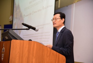 Chargé d’Affaires, Embassy of the Republic of Korea, Jin-Wook Kim, delivers remarks at a Korea-Jamaica Future Cooperation Forum, which was held at the University of the West Indies, Mona campus, on Friday (November 10).