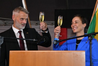 Minister of Foreign Affairs and Foreign Trade, Senator the Hon. Kamina Johnson Smith and Ambassador of the Federal Republic of Germany to Jamaica, His Excellency Jan Hendrik van Thiel, raise their glasses in a toast to commemorate Day of German Unity, during a reception held on Wednesday (November 2) at the German Embassy, 10 Waterloo Road in Kingston.

