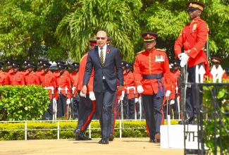 Governor-General, His Excellency the Most Hon. Sir Patrick Allen (left), is escorted by Acting Chief of Defence Staff, Brigadier Markland Lloyd, during Saturday’s (November 11) Remembrance Day ceremony at National Heroes Park in Kingston.