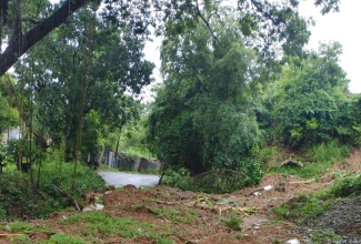 A section of Market Road in Port Morant, St. Thomas, which is currently impassable due to a landslide.

