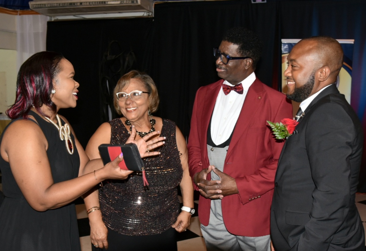 Permanent Secretary, Ministry of Education and Youth, Dr. Kasan Troupe (left), converses with (from second left), Past President, Jamaica Association of Insurance and Financial Advisors (JAIFA), Marcelle Fenton; President and Chief Executive Officer, MeriChan Group, Donovan Brown, and President, JAIFA, Denton Atkins. The event was the inauguration ceremony for JAIFA’s 70th President, held at the Terra Nova All-Suite Hotel in Kingston on November 25.