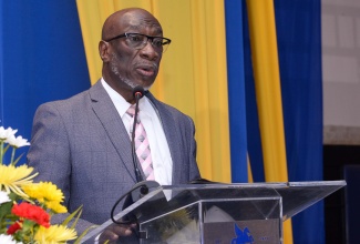 Acting Chief Technical Director, Ministry of Industry, Investment and Commerce, Karl Hyatt, addresses the opening ceremony of the Planning Institute of Jamaica (PIOJ) Best Practice Symposium in Social and Community Development 2023 on November 8 at The Jamaica Pegasus hotel in New Kingston.

