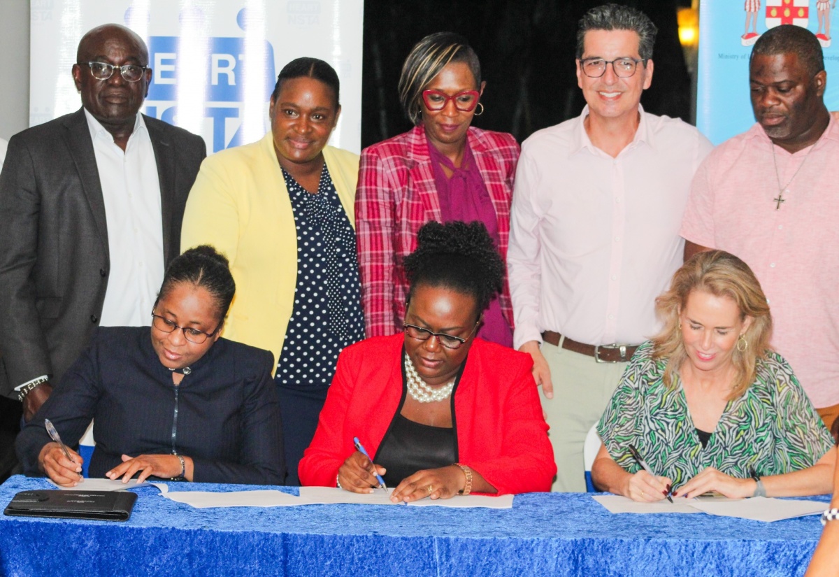 Representatives of the Hanover Municipal Corporation (HMC), Human Employment and Resource Training/National Service Training Agency (HEART/NSTA) Trust and Grand Palladium Jamaica Lady Hamilton Resort and Spa, the partners in the enhanced training, assessment, and upskilling programme, for which a Memorandum of Understanding (MOU) was signed on Wednesday (November 22). Seated for the signing are (from left) Deputy Managing Director, HEART/NSTA – Dr Cheryl McLaughlin; Director of Planning, HMC, Grace Whittley, and Corporate Director of Social Responsibility, Palladium Hotel Group, Gloria Juste Picon. Witnessing the proceedings are (from left) HMC Chairman and Mayor of Lucea, Councillor Sheridan Samuels; HEART/NSTA Trust Region 4 Regional Director, Shorna Newsome-Myrie; Deputy Mayor of Lucea, Councillor Adria Dehaney-Grant, and Councillor Daren Barnes of the Riverside Division. The signing took place at the Grand Palladium Jamaica Lady Hamilton Resort and Spa in Hanover.