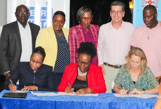 Representatives of the Hanover Municipal Corporation (HMC), Human Employment and Resource Training/National Service Training Agency (HEART/NSTA) Trust and Grand Palladium Jamaica Lady Hamilton Resort and Spa, the partners in the enhanced training, assessment, and upskilling programme, for which a Memorandum of Understanding (MOU) was signed on Wednesday (November 22). Seated for the signing are (from left) Deputy Managing Director, HEART/NSTA – Dr Cheryl McLaughlin; Director of Planning, HMC, Grace Whittley, and Corporate Director of Social Responsibility, Palladium Hotel Group, Gloria Juste Picon. Witnessing the proceedings are (from left) HMC Chairman and Mayor of Lucea, Councillor Sheridan Samuels; HEART/NSTA Trust Region 4 Regional Director, Shorna Newsome-Myrie; Deputy Mayor of Lucea, Councillor Adria Dehaney-Grant, and Councillor Daren Barnes of the Riverside Division. The signing took place at the Grand Palladium Jamaica Lady Hamilton Resort and Spa in Hanover.

