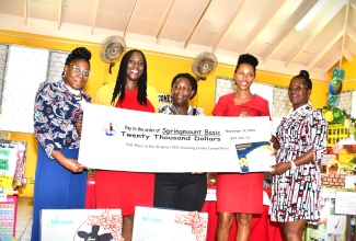 Teachers at Spring Mount Basic School, Shonique Gooden (third left) and Monique Teape (fourth left)  receive a prize cheque after their school placed second in the Early Childhood Commission (ECC) St James Learning Centre Competition, held at DRB Grant Resource Centre in Montego Bay recently. Sharing the moment are (from left) ECC Director of Sector Support Services, Simone Ellis-Dixon; ECC Development officer for St James, Michelle Colley-Grinion and ECC Sector Support Services Supervisor, Tafari Grant-Whyte.