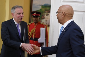  Governor General, His Excellency the Most Hon. Sir Patrick Allen (right), greets Ambassador-designate of the Argentine Republic, Marcelo Angel Balbi Calvo, during a courtesy call at King’s House today (November 23).

 