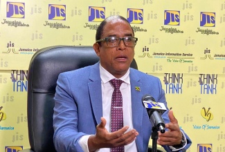 Minister of State in the Ministry of Labour and Social Security, Dr the Hon. Norman Dunn, speaks at a JIS Think Tank, today (November 29).

