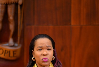 Permanent Secretary in the Ministry of Education and Youth, Dr. Kasan Troupe, addresses yesterday’s (November 22) post-Cabinet press briefing at Jamaica House in St. Andrew.