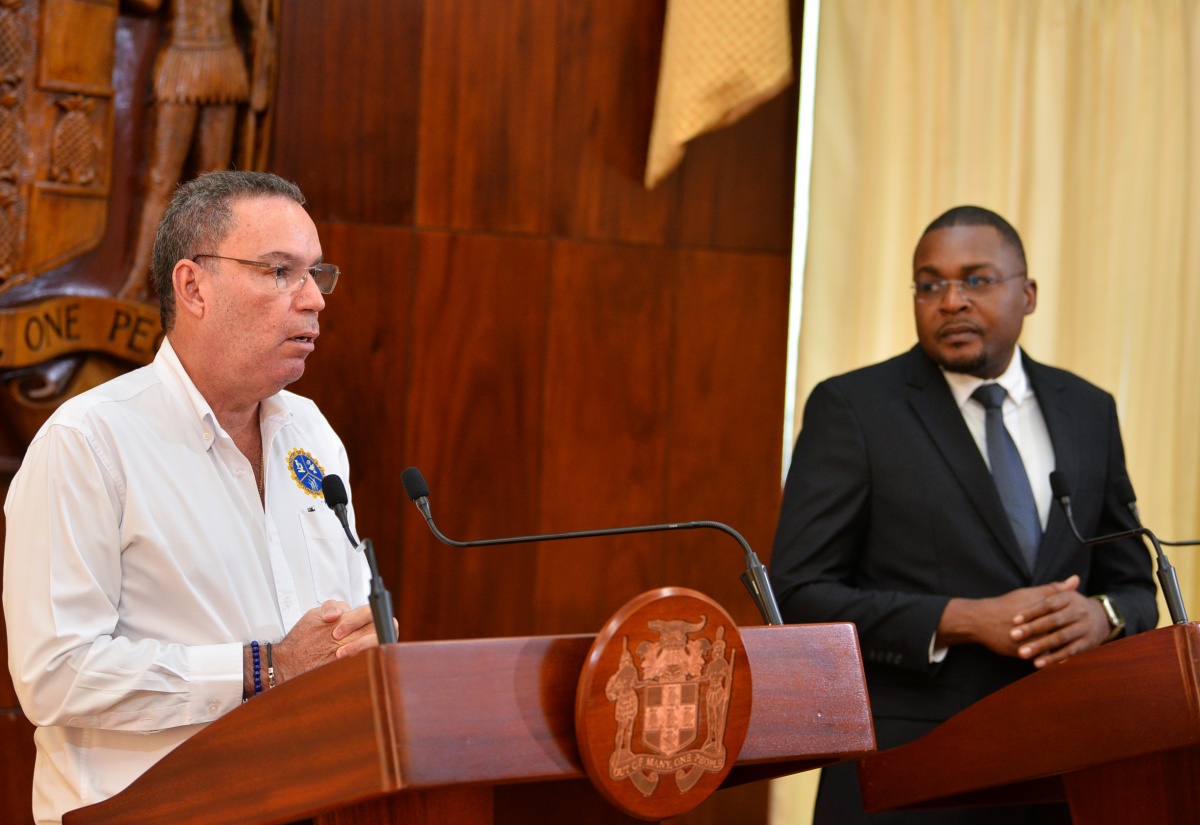 Minister of Science, Energy, Telecommunications and Transport, Hon. Daryl Vaz, addresses today’s (November 22) post-Cabinet press briefing at Jamaica House. Listening( at right) is Minister without Portfolio in the Office of the Prime Minister with responsibility for Information, Hon. Robert Morgan.

