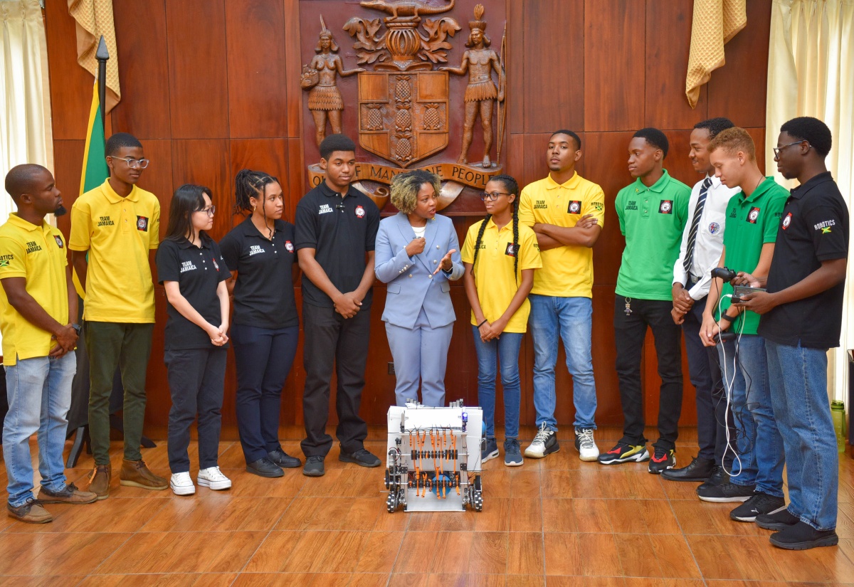 Minister Without Portfolio with Responsibility for Skills and Digital Transformation, Senator Dr. the Hon. Dana Morris Dixon (centre), congratulates members of Jamaica’s team copping Gold in the Robotics Olympics, which took place in Singapore from October 7 to 10. Minister Morris Dixon met with the members during their courtesy call at Jamaica House on Tuesday (October 31).

