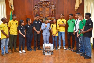 Minister Without Portfolio with Responsibility for Skills and Digital Transformation, Senator Dr. the Hon. Dana Morris Dixon (centre), congratulates members of Jamaica’s team copping Gold in the Robotics Olympics, which took place in Singapore from October 7 to 10. Minister Morris Dixon met with the members during their courtesy call at Jamaica House on Tuesday (October 31).

