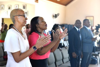 Minister of Education and Youth, Hon. Fayval Williams (left) and Permanent Secretary in the Ministry, Dr. Kasan Troupe, participate in the Anti-Gang Week Church Service held at the Rose Town Holiness Christian Church in Kingston today (November 5).  