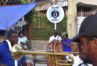 Members of the Waterhouse Steppers Band perform during the launch of community Wi-Fi service in Yallahs, St. Thomas, on Monday (October 30).
