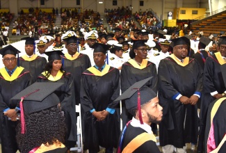 Members of the Caribbean Maritime University (CMU) Class of 2023 participate in the graduation ceremony held on November 16 at the National Indoor Sports Centre in Kingston.
