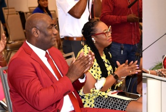 Chief Executive Officer, First Heritage Co-operative Credit Union, Roxann Linton (right), addressing the Civil Service Week public forum at the AC Hotel by Marriott Kingston on November 21. The event was held under the theme ‘Raising the Bar: Strengthening the Bond’.

