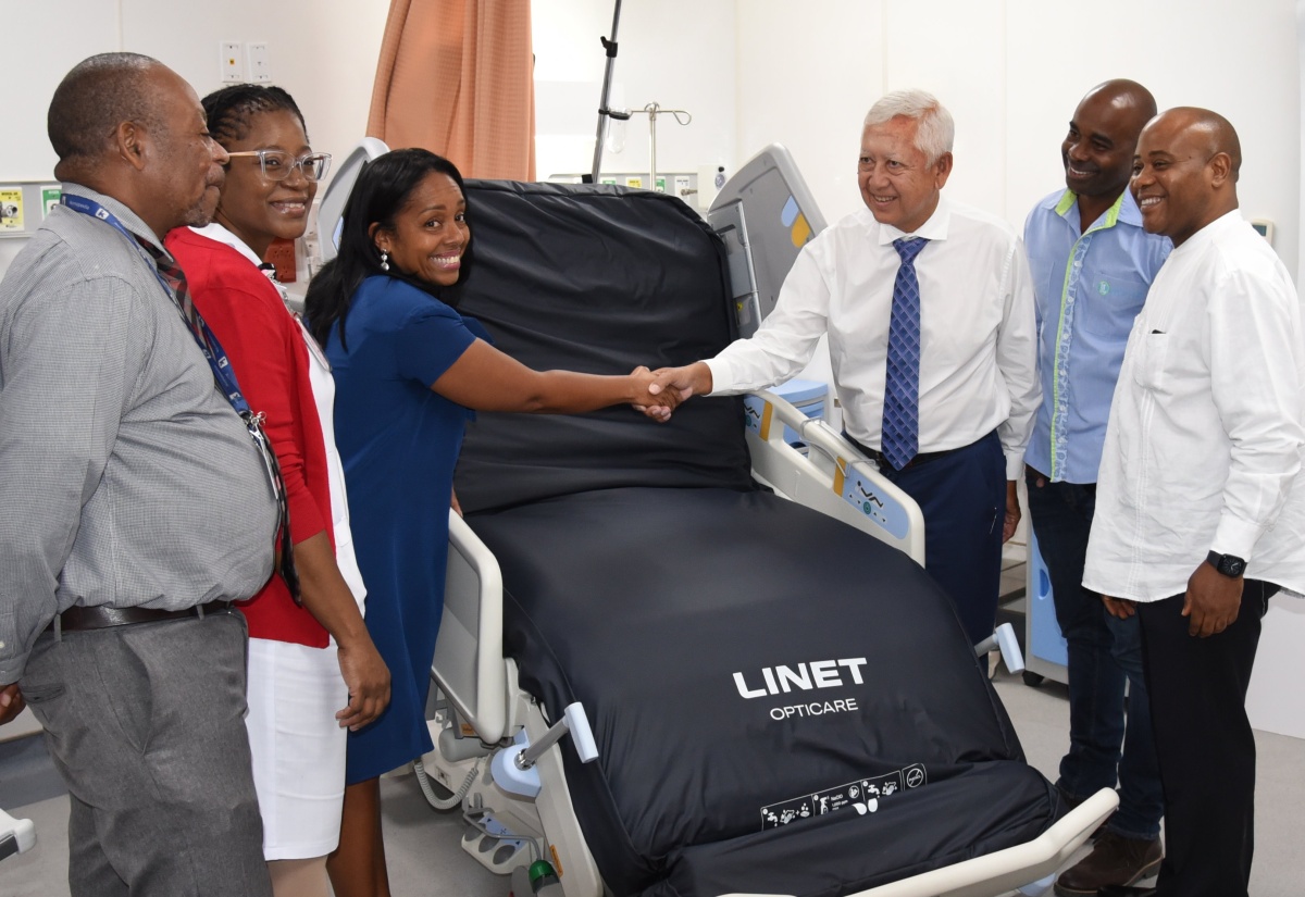 Acting Chief Executive Officer, University Hospital of the West Indies (UHWI), Fitzgerald Mitchell (left), along with (from second left), Nurse Manager, Intensive Care Unit (ICU) and Recovery Room, UHWI, Marsha Downer-Campbell; Representative from Medical Link Limited, Paula Walker; Board Chairman, UHWI, Wayne Chai Chong; Chief Executive Officer, Medical Link Limited, Lainsworth Walker, and Head of the ICU UHWI, Dr. Kelvin Metalor, accepts an ICU Bed donated by Medical Link Limited and the LINET Group, during a ceremony held at the institution in Kingston on Tuesday (November 21). LINET’s new premium high-end intensive care bed features a frame-based lateral tilt solution, developed to help patients recover faster and reduce physical strain on medical personnel. Together with Smart Care Solution, they contribute to more efficient medical care and reduction of administrative tasks.

