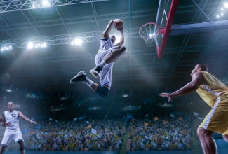 Basketball players on big professional arena during the game. 