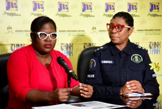 Director of Communications, Consumer Affairs Commission, Latoya Halstead, shares tips for consumers to follow during the Christmas season, while addressing a recent Think Tank at the JIS head office in Kingston. Listening is Senior Superintendent of Police and Head of the Jamaica Constabulary Force (JCF) Corporate Communications Unit, Sephanie Lindsay,

