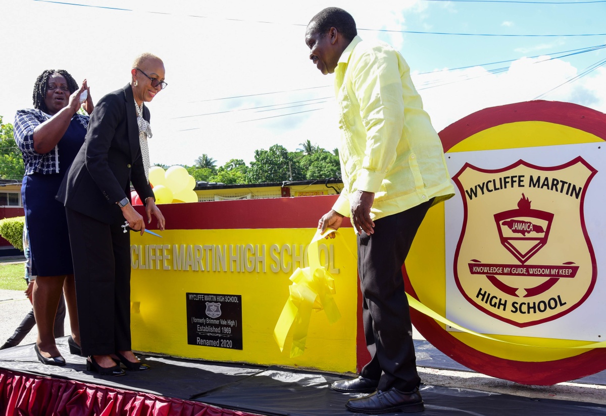 Minister of Education and Youth, Hon. Fayval Williams (second left), cuts the ribbon to symbolise the official renaming of the Brimmer Vale High School in Port Maria, St. Mary, to the Wycliffe Martin High School during a ceremony on November 30. Sharing in the moment (from left) are Principal, Evorine Henry Tracey; and Member of Parliament for St. Mary Western, Robert Montague. Wycliffe Martin became Member of Parliament for St. Mary Central in 1962, and made significant contributions to the development of the constituency and the parish. 