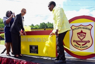 Minister of Education and Youth, Hon. Fayval Williams (second left), cuts the ribbon to symbolise the official renaming of the Brimmer Vale High School in Port Maria, St. Mary, to the Wycliffe Martin High School during a ceremony on November 30. Sharing in the moment (from left) are Principal, Evorine Henry Tracey; and Member of Parliament for St. Mary Western, Robert Montague. Wycliffe Martin became Member of Parliament for St. Mary Central in 1962, and made significant contributions to the development of the constituency and the parish.
