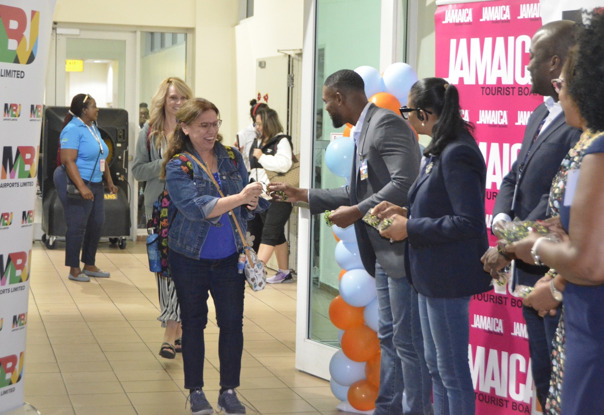 Deputy Mayor of Montego Bay, Councillor Richard Vernon (second left), heads the welcoming party for passengers of the inaugural Canada Jetlines flight from Toronto, Canada, at the Sangster International Airport on December 9. Also greeting passengers are (from third left) Regional Director of the Jamaica Tourist Board (JTB), Odette Dyer; Chief Executive Officer of MBJ Airports, operators of Sangster International Airport, Shane Munroe and Regional Director of JTB, Canada, Angella Bennett.

