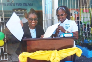 Jamaican-born Mayor of Barking and Dagenham in the United Kingdom (UK), Councillor Donna Lumsden (left), is being introduced by teacher at Maverley Primary School in St. Andrew, Shanika Battiste, before addressing students. The mayor, who is a former student of Maverley Primary, stopped at the institution during her recent visit to the island.

 