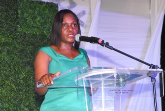 Permanent Secretary in the Ministry of Economic Growth and Job Creation, Arlene Williams, addresses the Ministry’s end-of-year staff appreciation function, held on December 14 on the lawns of the Police Officers’ Club in Kingston.

