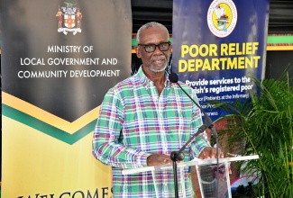 Minister of Local Government and Community Development, Hon. Desmond McKenzie, addresses Friday’s (December 8) official opening of the Clarendon Drop-In Centre and Night Shelter, which is located on the property of the Clarendon Infirmary.

