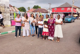 Members of the ‘Sharing and Caring Indian Women in Jamaica’ group that assisted with the preparation and distribution of care packages to residents of Dr. B.R. Ambedkar Avenue in downtown Kingston on December 17.