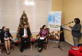 Prime Minister, the Most Hon. Andrew Holness, listens as the Global Jamaica Diaspora Council representative for the USA Northeast, Michelle Tulloch-Neil (right), asks a question, at last night’s (December 6) monthly series, ‘Let’s Connect with Ambassador Marks’, at the Embassy of Jamaica in Washington DC. Also listening (from left) are Foreign Affairs and Foreign Trade Minister, Senator the Hon. Kamina Johnson Smith, and Jamaica’s Ambassador to the United States, Her Excellency Audrey Marks.

